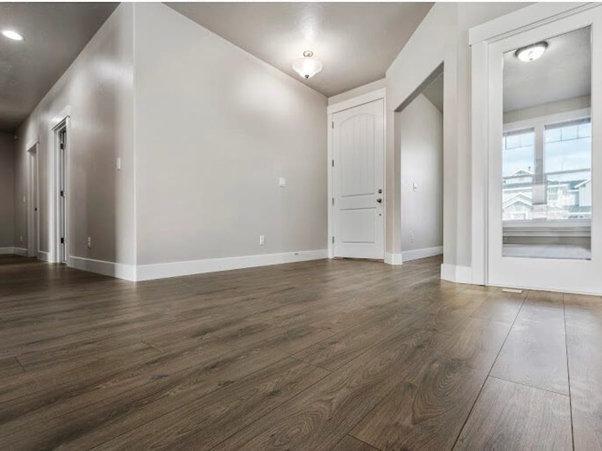 Dark plank, open living space finished in Hardwood