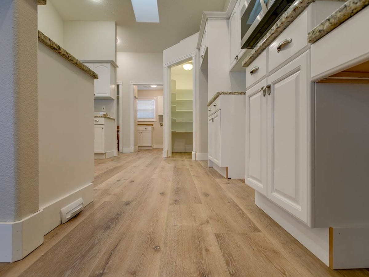 Kitchen through to the hallway finished in Laminate