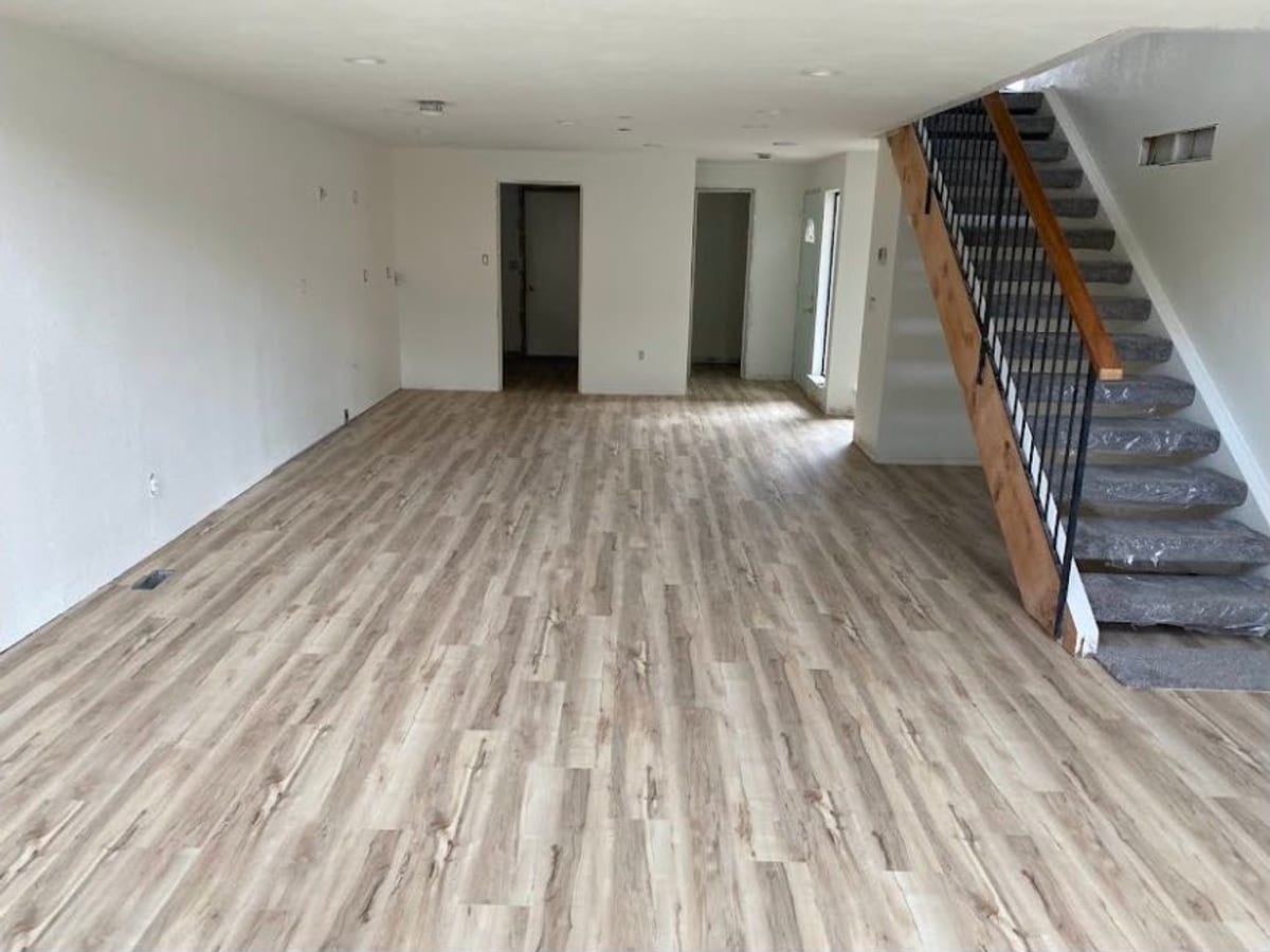 Open-plan living room finished in Luxury Vinyl Plank